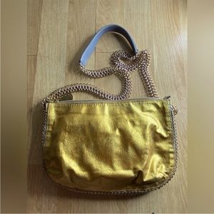 Stella McCartney gold and silver double sided crossbody chain bag.